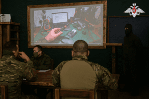 In this photo taken from video distributed by the Russian Defense Ministry Press Service on Monday, May 26, 2025, Russian serviceman train to operate military drones in an undisclosed location. (Russian Defense Ministry Press Service via AP