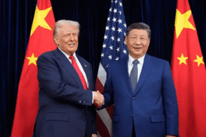 President Donald Trump, left, and Chinese President Xi Jinping shake hands